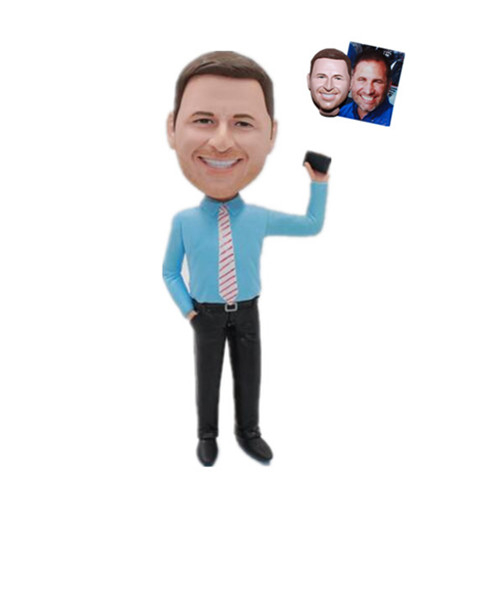 Businessman Bobbleheads In Blue Shirt With Cellphone In Hand